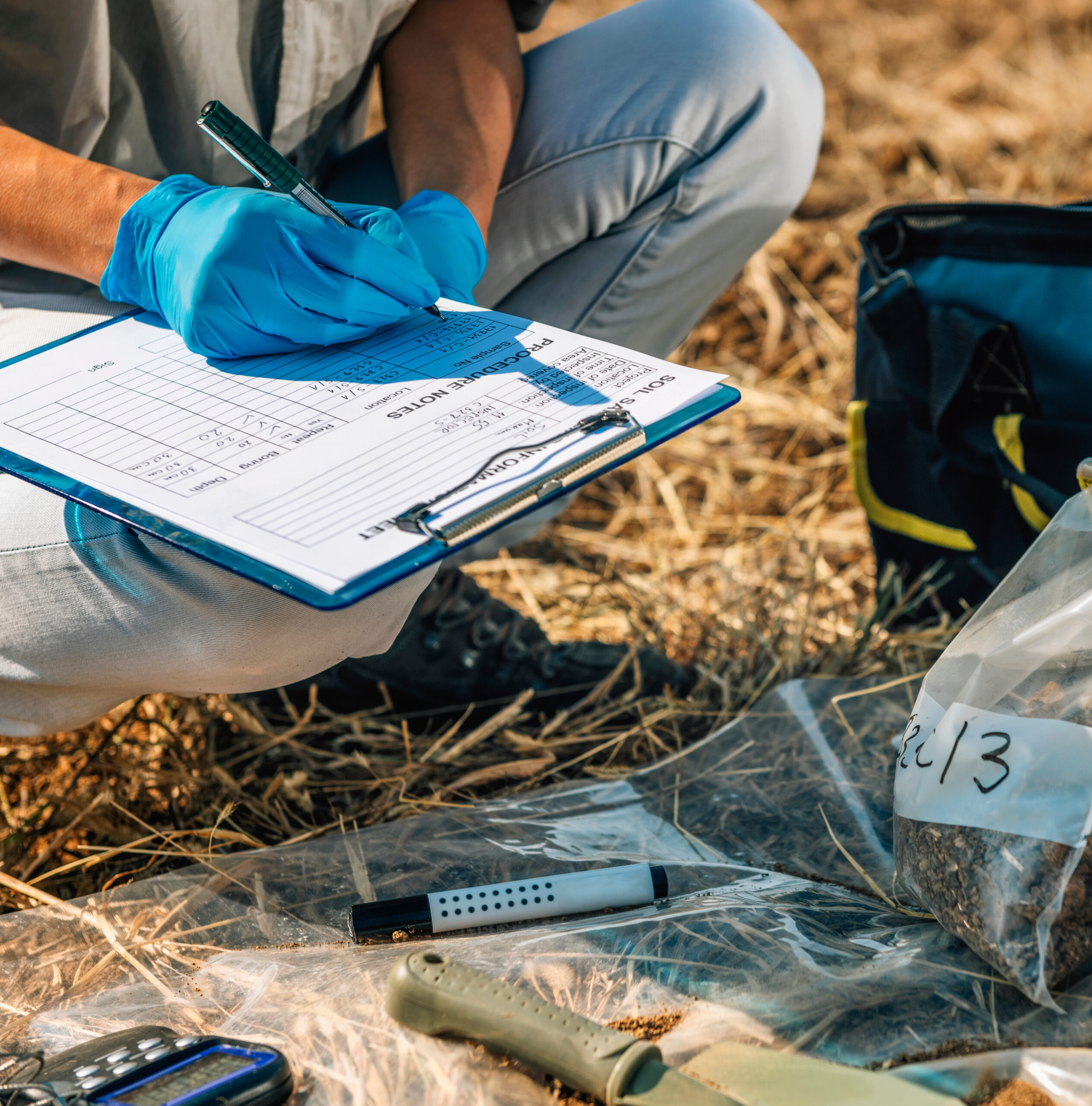 Soil Test. Female agronomist taking notes in the field. Environmental protection, organic soil certification, research